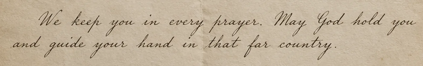 Handwritten line from the letter: We keep you in every prayer. May God hold you and guide your hand in that far country.